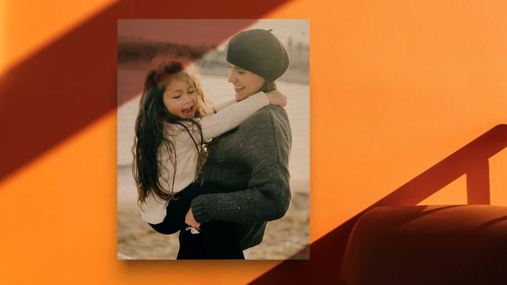 A romantic photograph of a couple embracing outdoors in winter clothing.